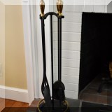 D24. Brass and iron fireplace tools. 